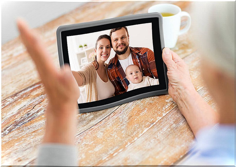 Family making video call with one of the applications to cope with isolation.