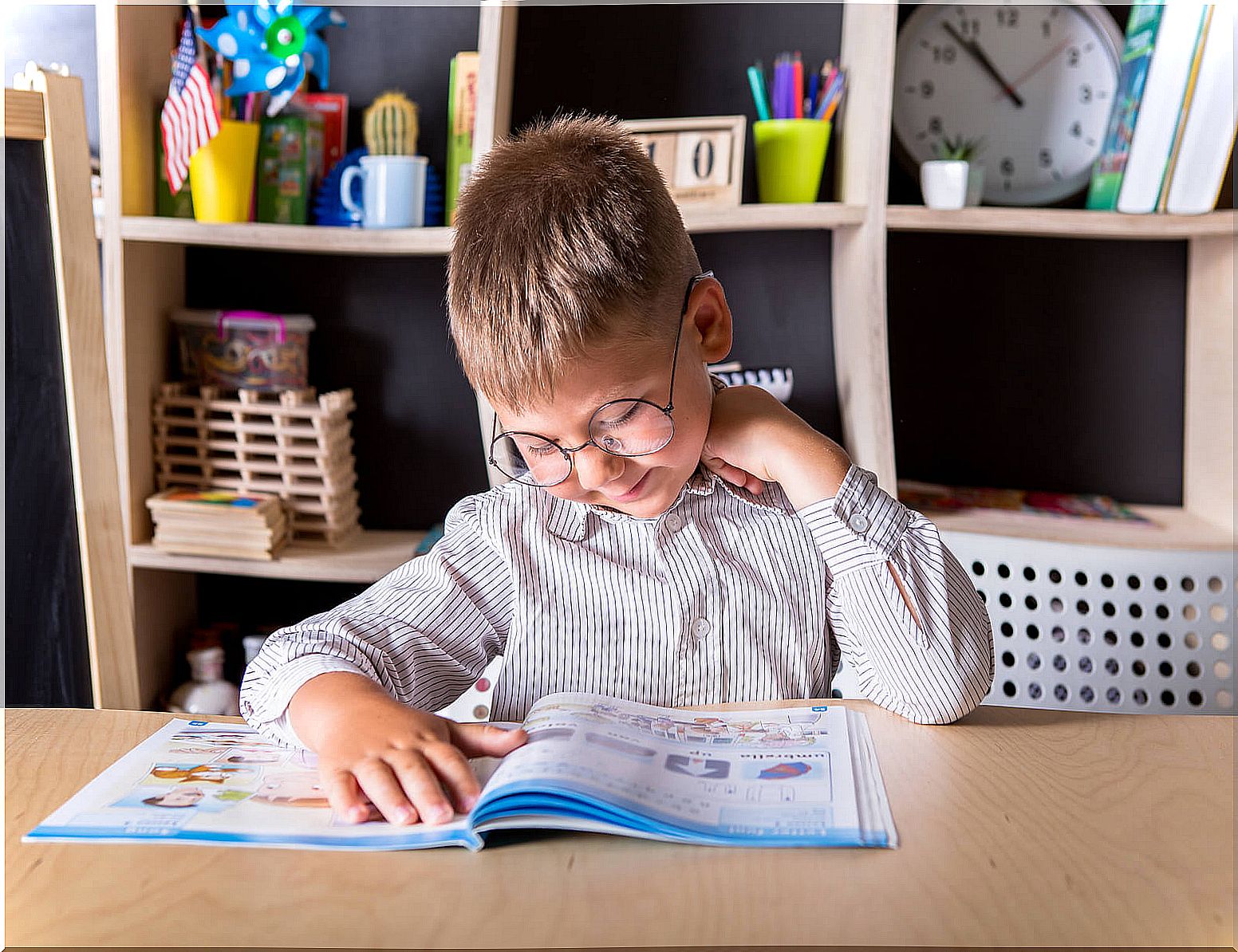 Child doing homework in his study area at home.