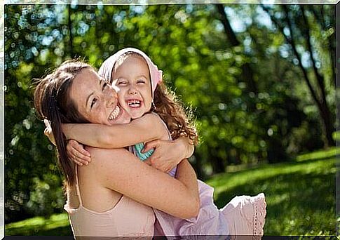 mother-hugging-daughter-laughing