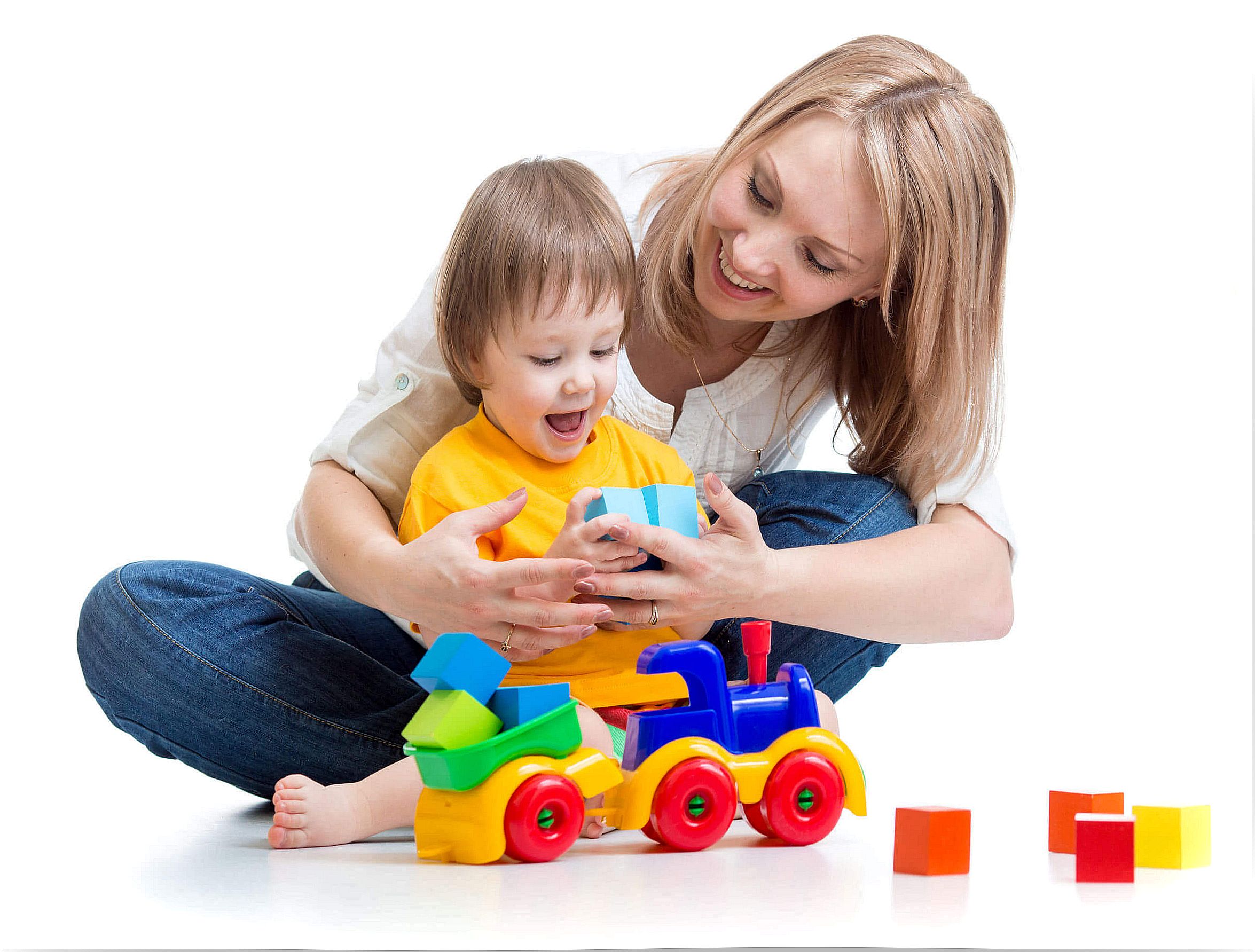 Mother practicing stimulation at home with her son through play.