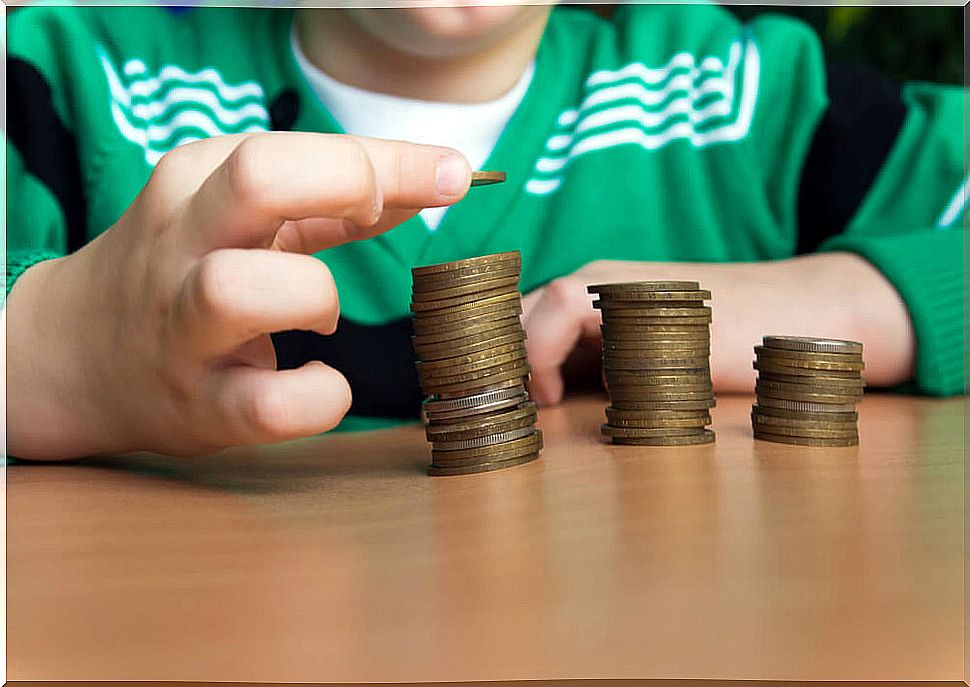 Child counting the money he has to learn how to save.