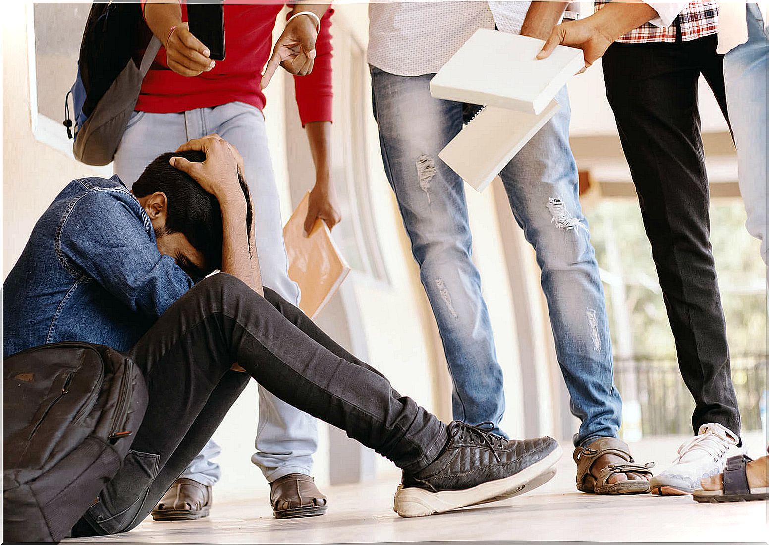 Boy being bullied by his classmates.