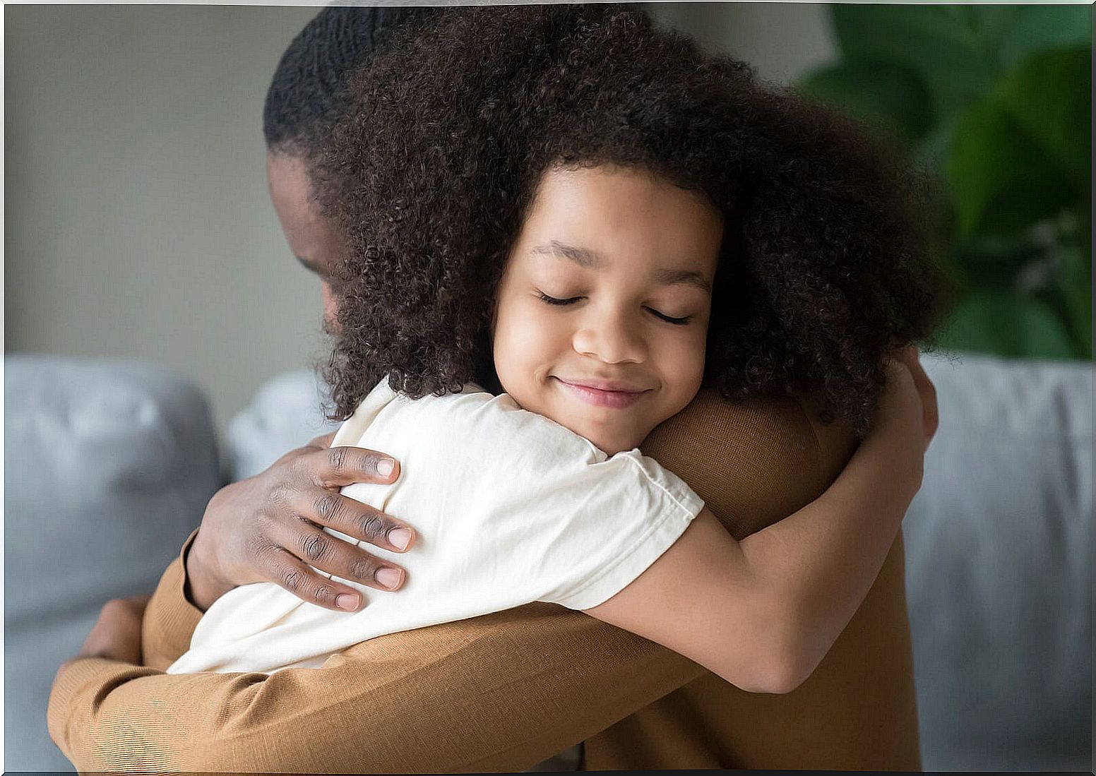 Daughter giving her father a hug.