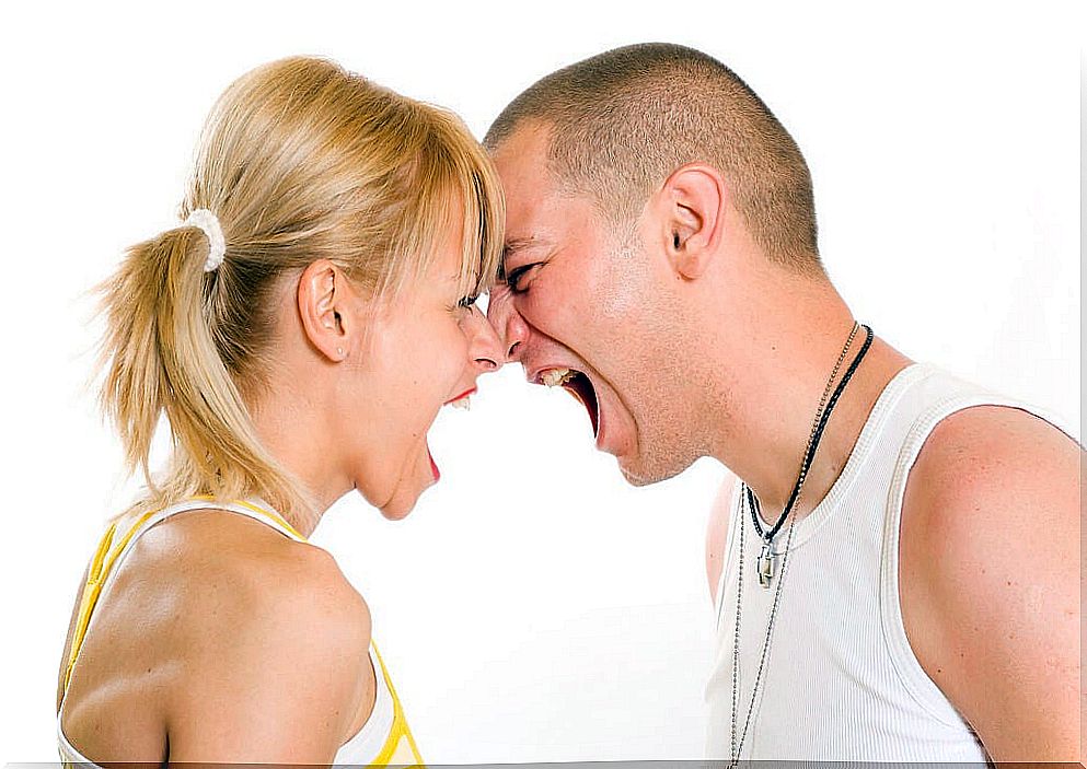 Angry twenty something couple yelling at each other