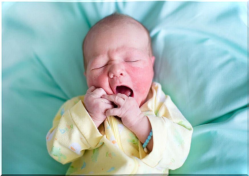 Newborn baby yawning.