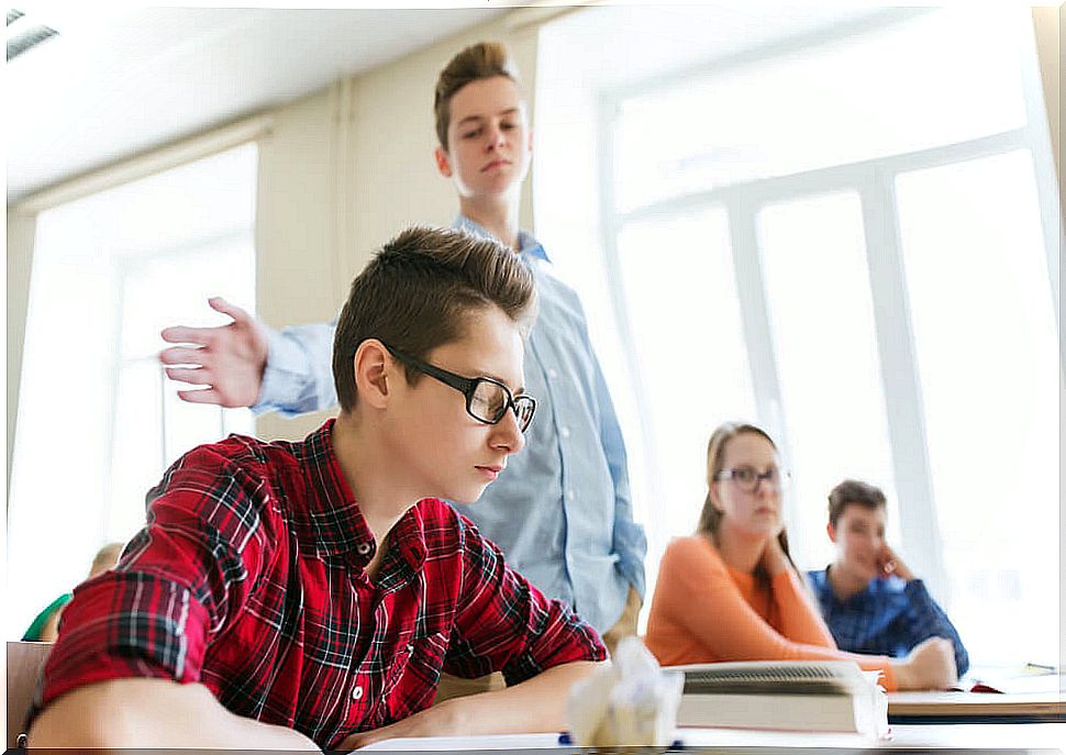 School bully giving a classmate a slap.