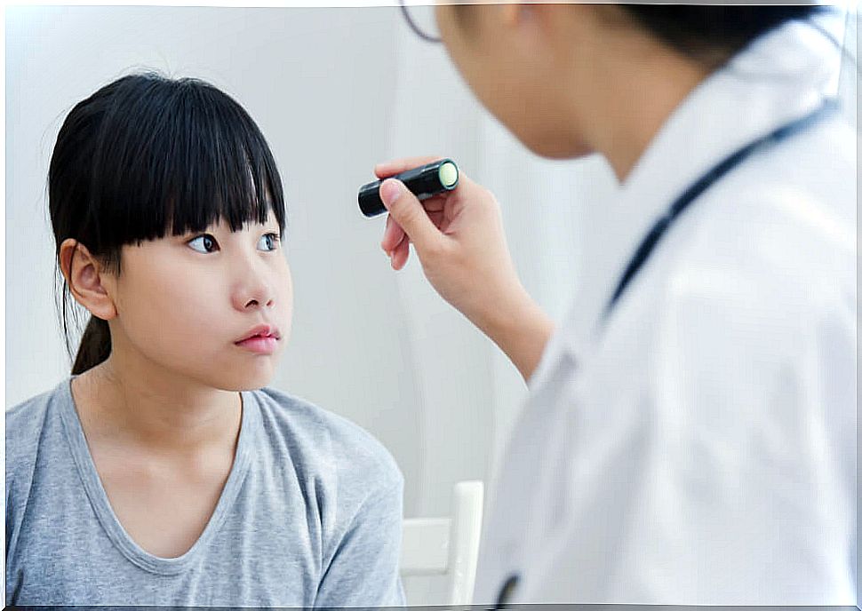 Girl at the ophthalmologist's office to rule out childhood glaucoma.