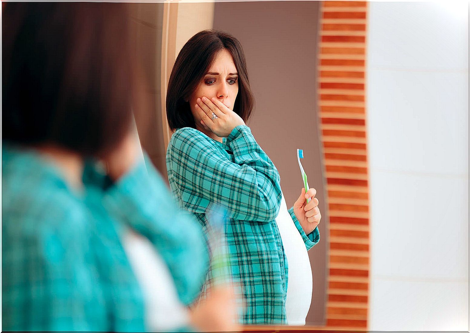 Woman with gums that bleed during pregnancy.