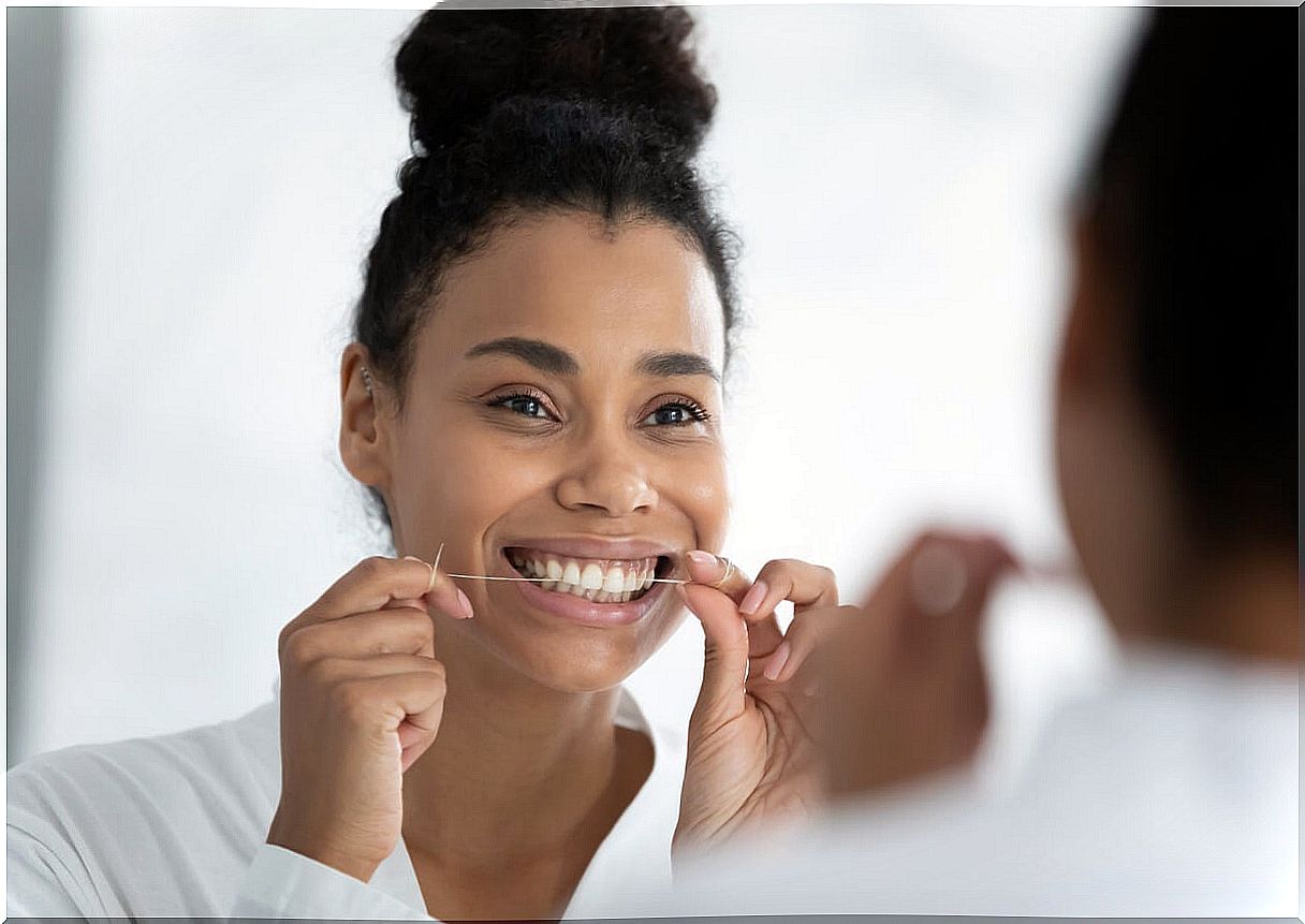 Pregnant woman flossing.