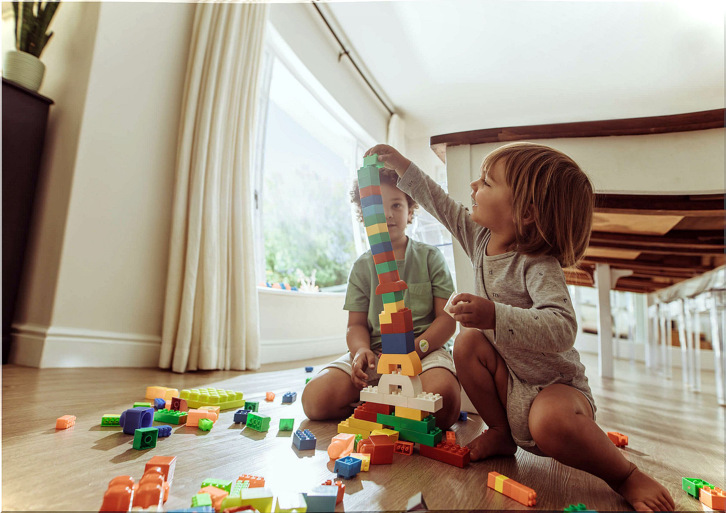 Children playing with LEGO pieces.