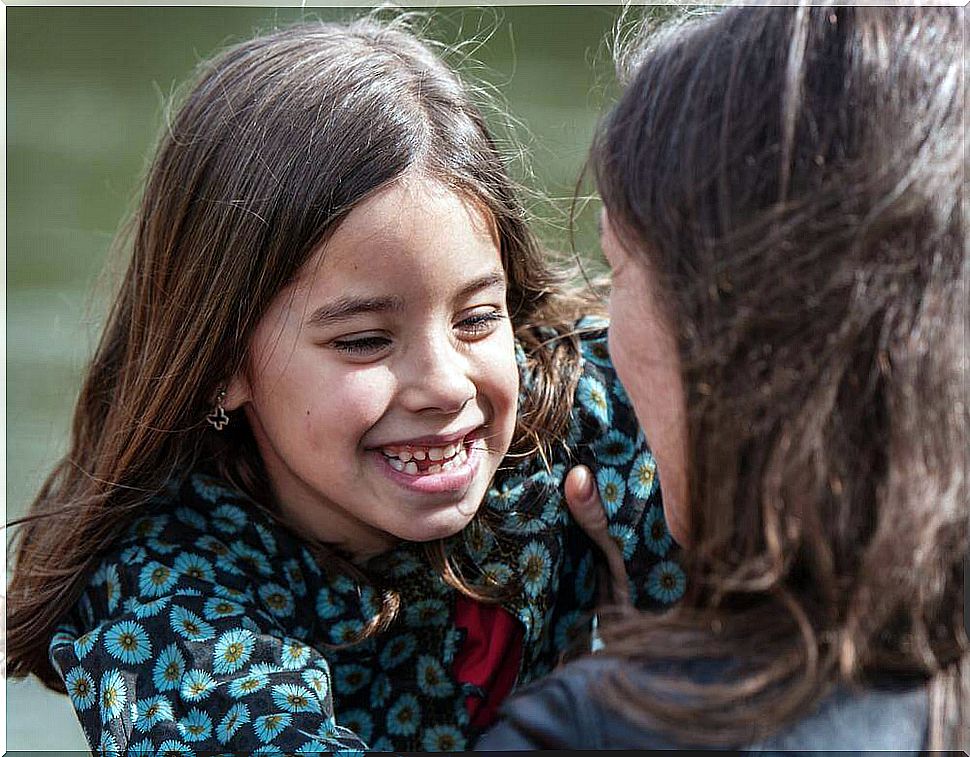 girl-smiling-with-her-mother