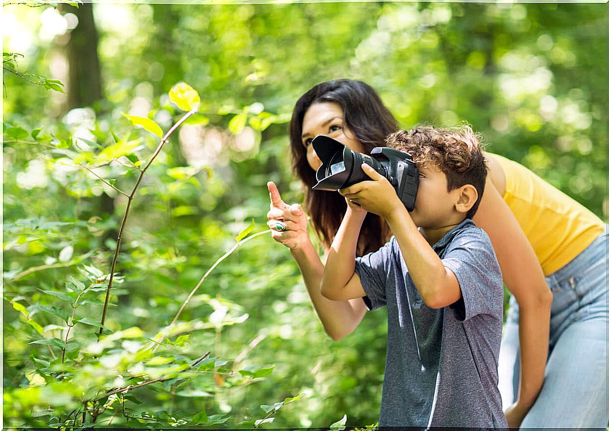 Mother making artistic photos with her son.