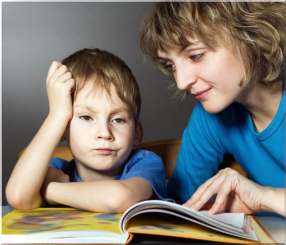 Mother trying to get her son to learn to read before the age of 6.