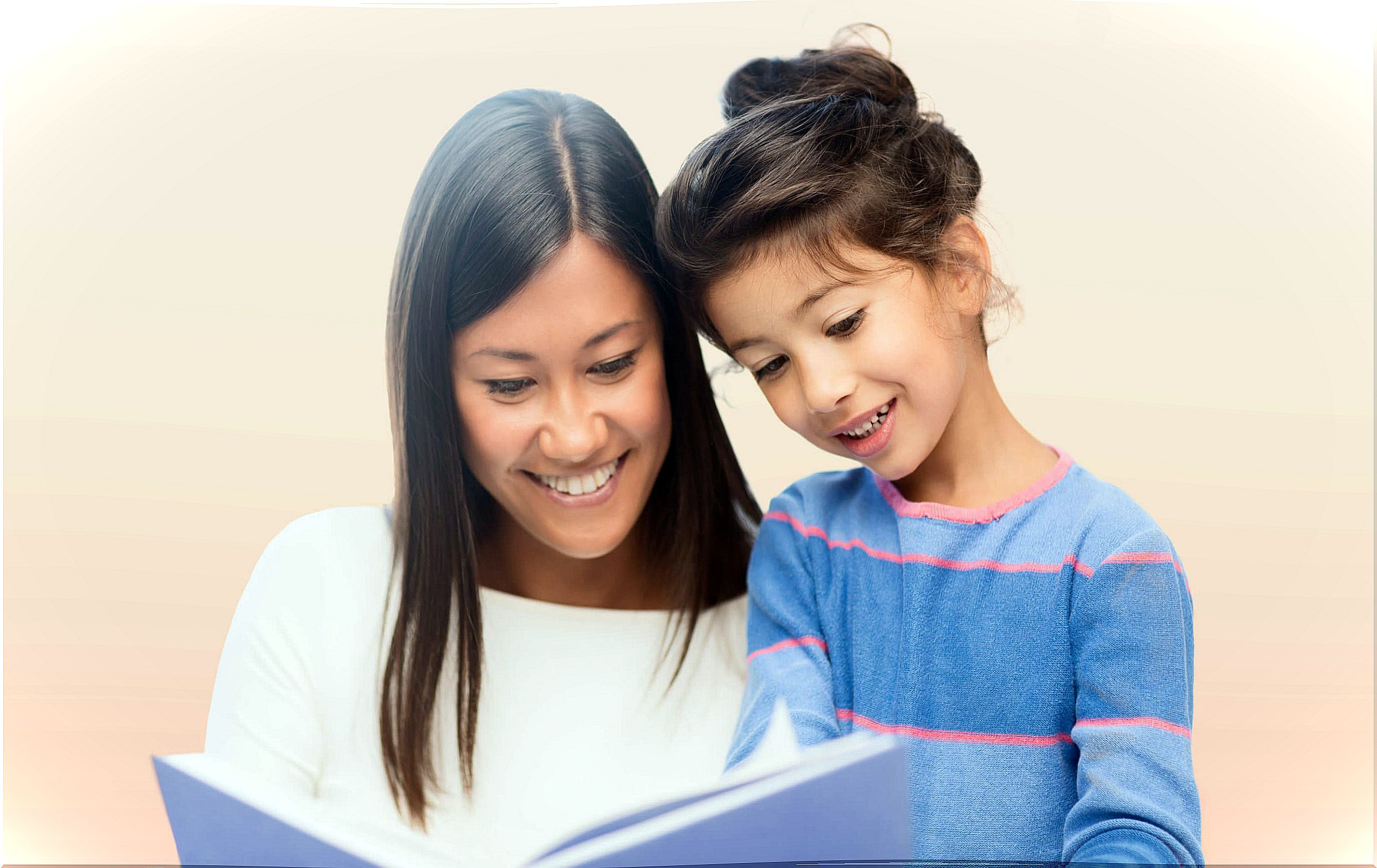 Mom reading a story to her daughter.