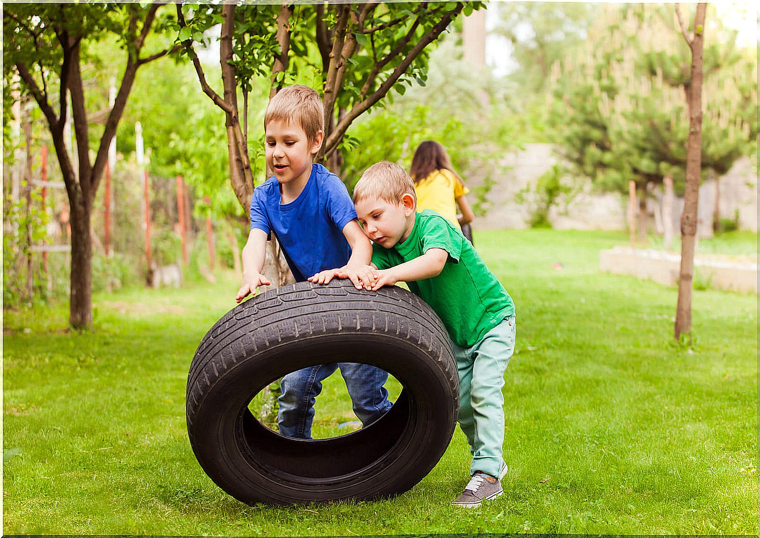 Children playing with a giant prayer learning to let go of control.