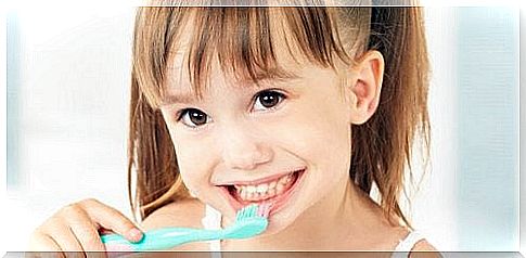 Girl brushing her teeth using shaping and chaining techniques.