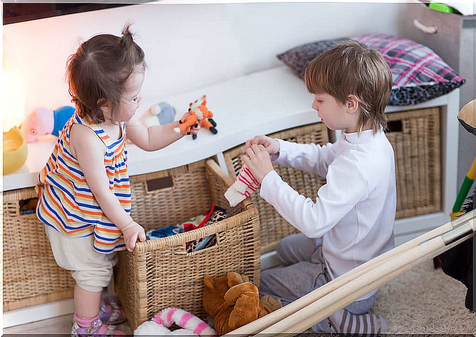 Children picking up their toys using shaping and chaining techniques.