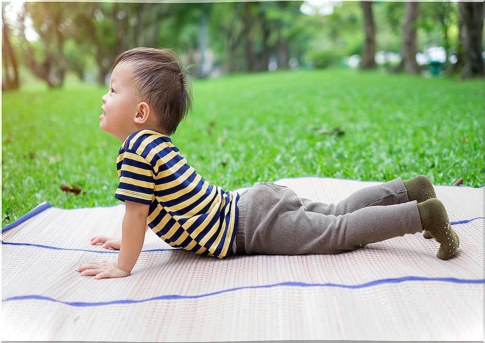 Child lying on the floor doing relaxation exercises.