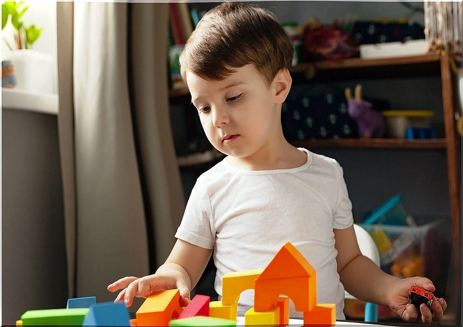 Child playing with building blocks.