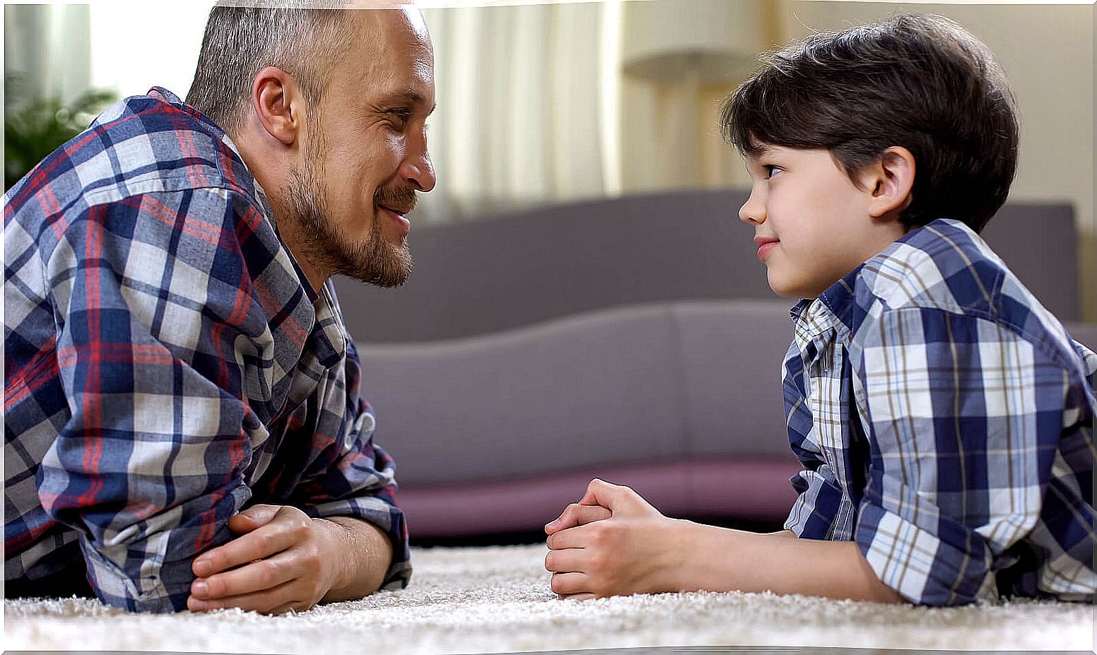 Father talking to his son using the discipline of good intentions.